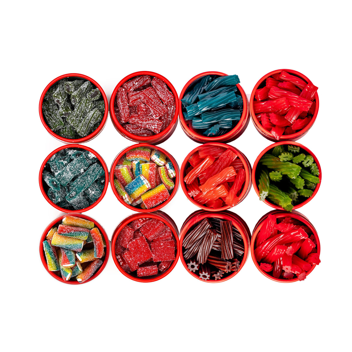 Assorted colorful licorice candies displayed in red bowls on a white background.